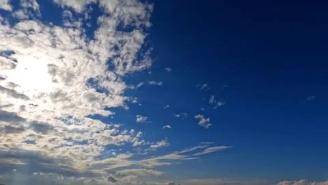 Cloudiness rare nice white clouds in the summertime sky - photo of nature 写真素材