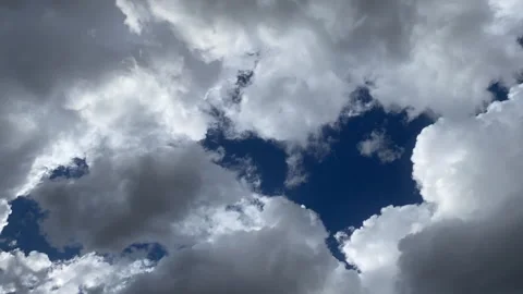 CloudlapseBacklitMoodySlowMovingRight1 Stock Footage 285541747