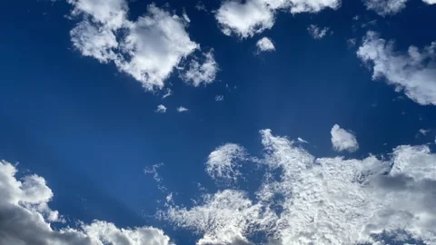 CloudlapseBacklitSkySunbeamsMovingLeftFrontComesIn Stock Footage 285541141