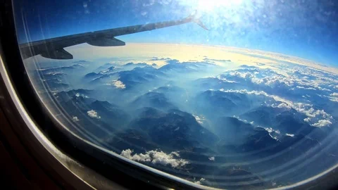 Cloud/Mountain view from airplane window [4K60p] Stock-Footage 127133195