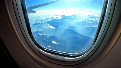 Cloud/Mountain view from airplane window [4K60p] Stock-Footage 127133229