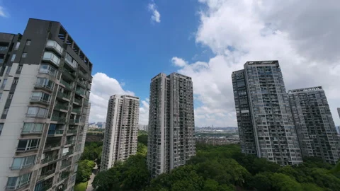 Cloud‑moving time‑lapse over modern high‑rise residential apartment towers Stock Footage 344830115