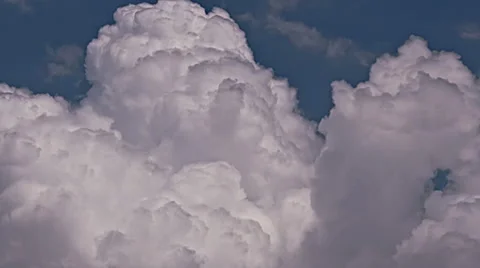 Clouds 07 06-26-14 TLFluffy cumulus clouds against light blue sky - time lapsed Video stock 40007563