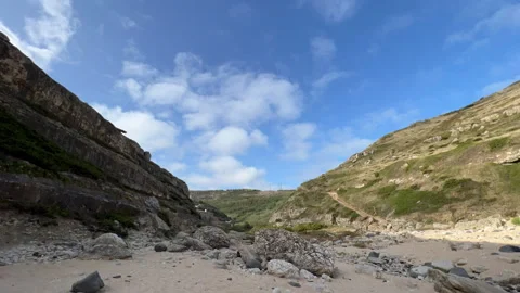 Clouds above the beach time lapse cliff Stock Footage 245744805