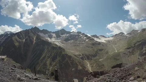 Clouds above the big snowy caucasus mountains Stock Footage 118594498