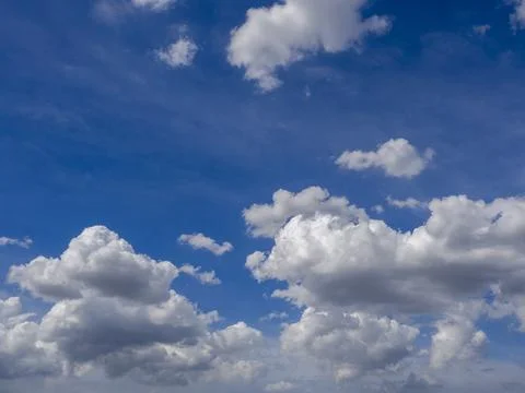 Clouds above the blue sky Stock Photos