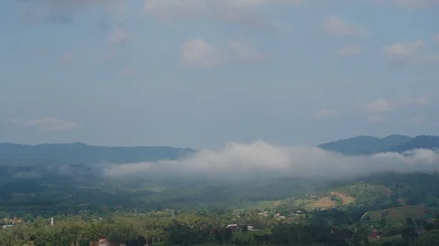 Clouds above the green forest in the countryside in the morning. Cumulus clouds  Stock Footage 121576848