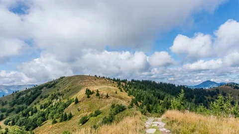 Clouds above green forest nature mountain in sunny autumn landscape Time lapse Stock Footage 153616675