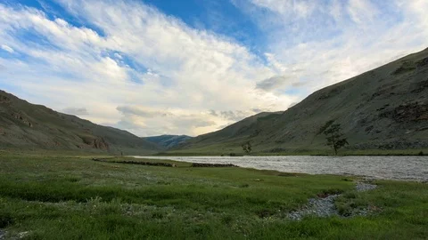 Clouds above the Khovd river, Mongolian Altai, Mongolia. Full HD Video stock 71773462