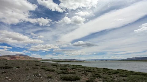 Clouds above the Khovd river, Mongolian Altai, Ulgii, Mongolia. Full HD Stock Footage 72870016