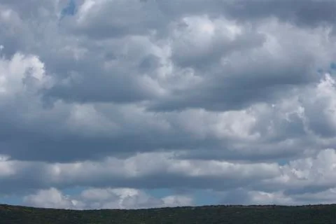 Clouds above the mountain Stock Photos