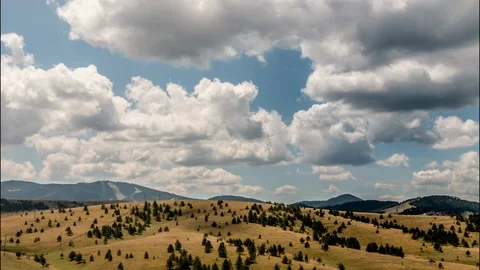 Clouds above a mountain plateau 4K Stock Footage 116897411