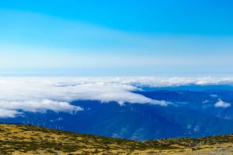 Clouds above mountain. Serra da Estrela in Portugal. Torre peak. Stock Photos