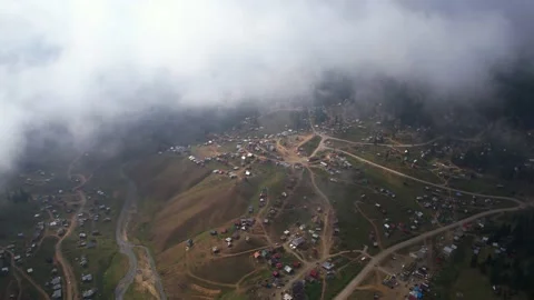Clouds above the mountain village Stock Footage 235612823