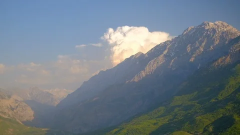 Clouds above the mountains and valley Stock Footage 108084911