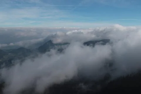 Clouds above mountains Stock Photos