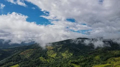 Clouds above the mountains Stock Photos