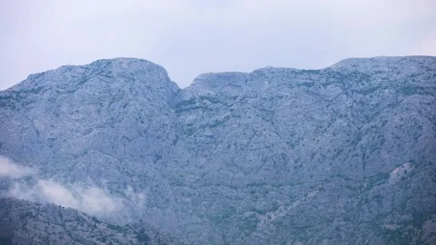 The clouds above the mountains - time lapse Stock Footage 246808362