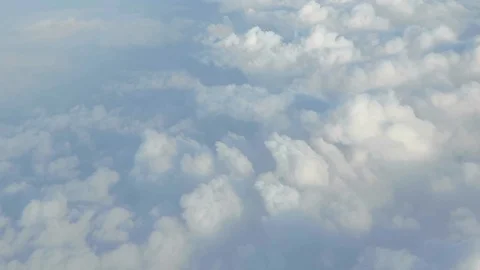 Clouds from above out of an airplane window Stock Footage 87729750