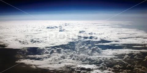Clouds from above panoramic image during flight Stock Photos
