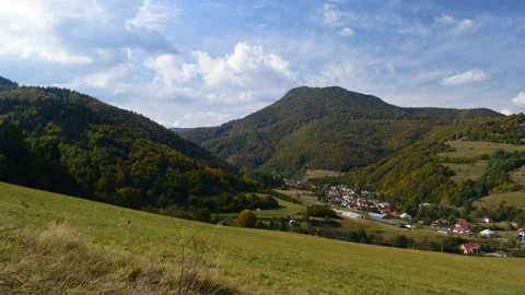 Clouds above the small town between the hills Stock Footage 132256322
