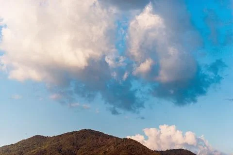 Clouds above the top of the hill Stock Photos
