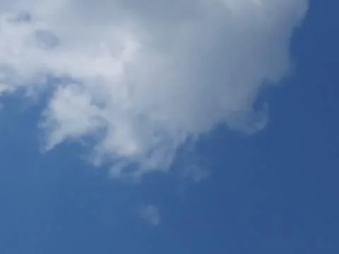 Clouds across blue sky Stock-Fotos
