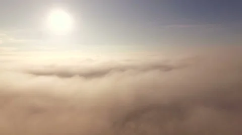 Clouds Aerial above the clouds panning left Stock Footage 56134279
