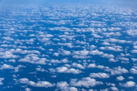 Clouds from an Aerial View sky perspective from above looking down on the c.. Stock Photos