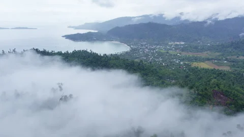 Clouds after tropical downpour off the coast Stock Footage 272747101