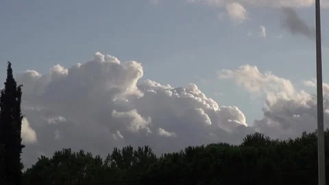Clouds afternoon sundown sky pine trees countryside nature sunlight Stock Footage 333183440
