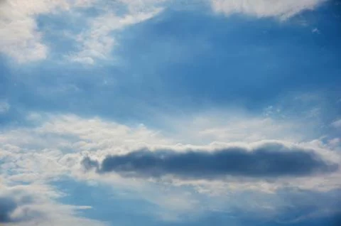 Clouds against blue sky as background Stock Photos