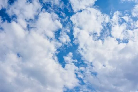 Clouds against blue sky as background Stock Photos