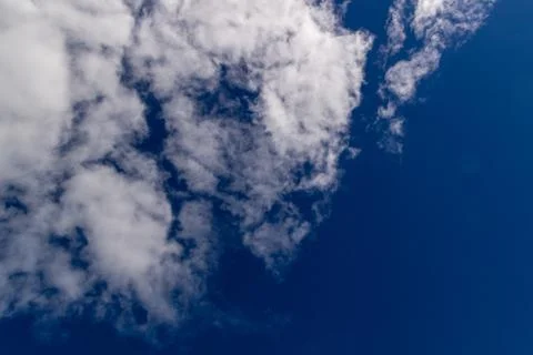 Clouds against blue sky as background Stock Photos