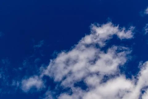 Clouds against blue sky as background Stock Photos