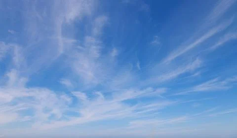 Clouds against the blue sky Stock Photos