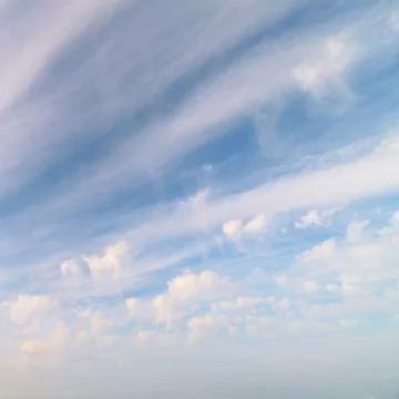 Clouds against the blue sky Stock Photos