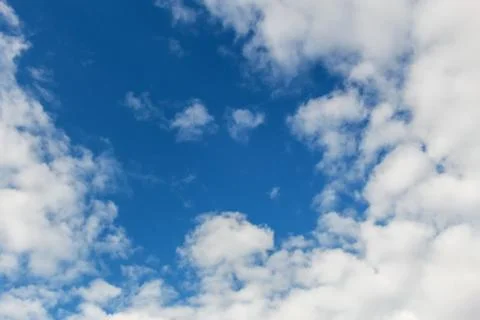 Clouds against the blue sky. Stock Photos