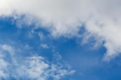 Clouds against the blue sky. Stock Photos