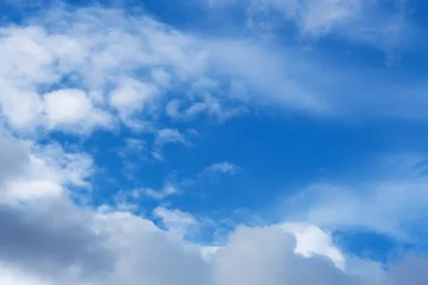 Clouds against the blue sky. Stock Photos