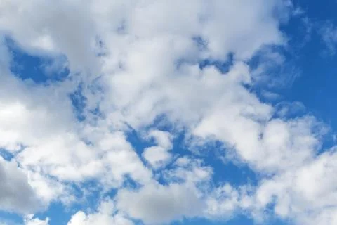 Clouds against the blue sky. Stock Photos