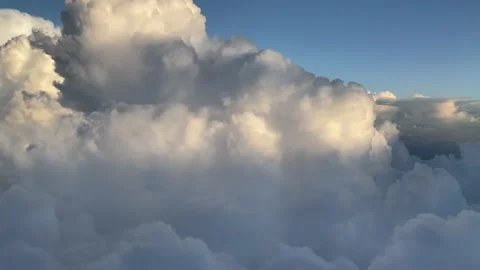 Clouds from airplane at dusk Stockbeeldmateriaal 157570187
