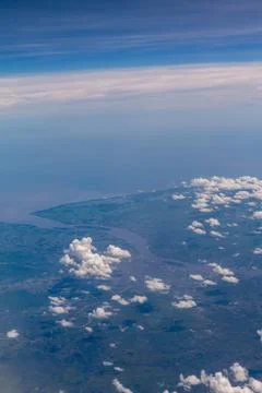 Clouds in airplane window Stock Photos