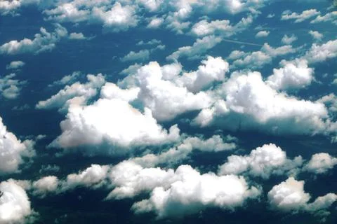 Clouds from airplane wing view Stock Photos