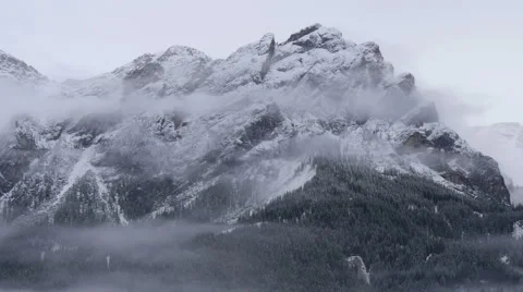 Clouds along dolomite smowy summit 4k 11705 Stock Footage 55823093