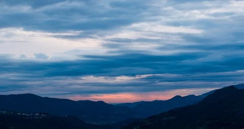 Clouds on an alpine valley in the evening Stock Footage 115943733