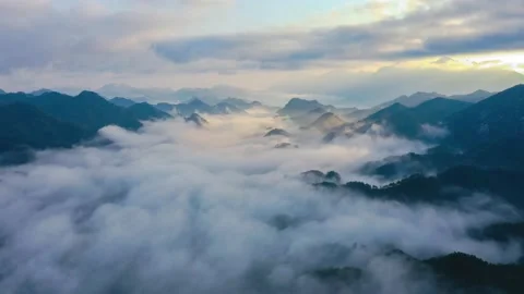 The clouds among the mountains flow slowly. Stock Footage 233674727