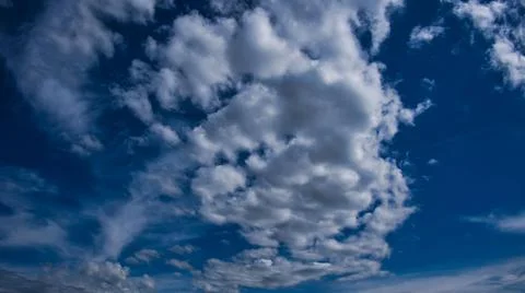 Clouds and blue lumisky Stock Photos