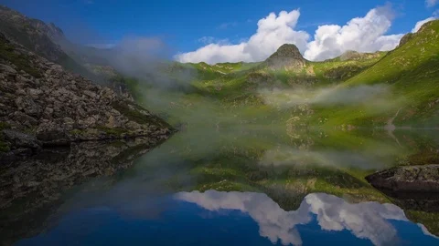 Clouds and blue sky are reflected in a glacial lake Stock-Footage 88192338
