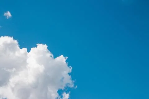 Clouds and blue sky background with copy space. Stockfoto's